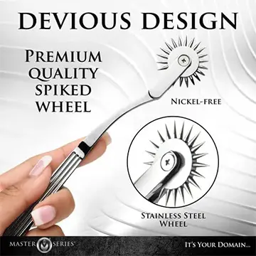 A hand holds a spiked stainless steel wheel.