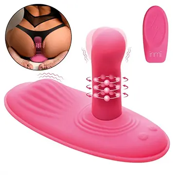 A pink device with several attachments and a picture of it.