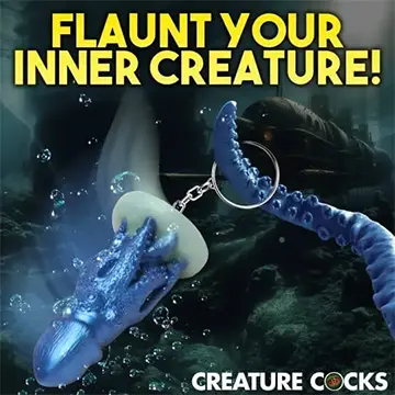 Blue octopus keychain with a white disc.