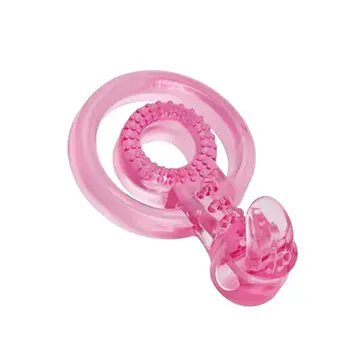 Pink plastic teething ring with textured surface.
