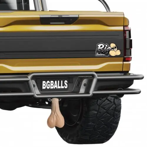 Yellow truck with a bumper sticker.