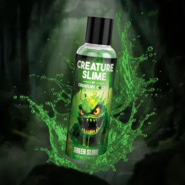A bottle of green slime with the words creature slime written on it.