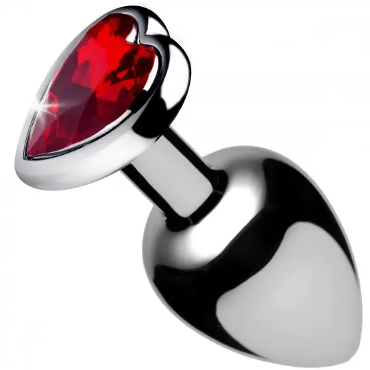 A red heart shaped attachment is shown on the side of a silver object.