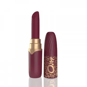 Red lipstick with decorative gold accents.
