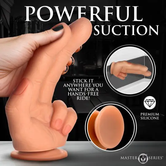 Realistic suction dildo held in hand with detailed texture.
