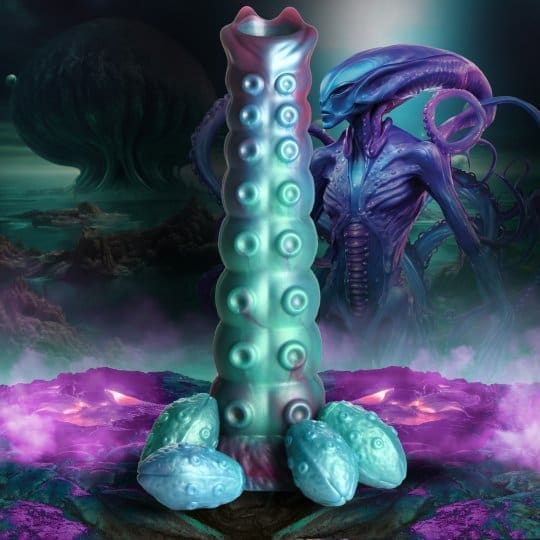 Blue and green tentacle toy with alien.