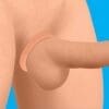 A close up of the arm and leg of someone with a penis ring.