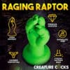 Green dinosaur-shaped sex toy on a base.