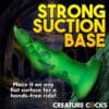 Green hand-shaped object with strong suction base.