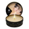 Vanilla scented massage candle with a lid.