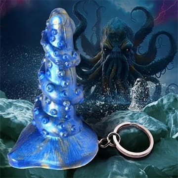 Blue tentacle keychain with Cthulhu in background.
