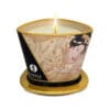 A golden candle with a romantic image.