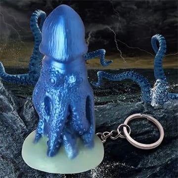 Blue octopus keychain with glowing base.