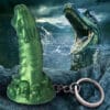 Green monster keychain with a silver ring.