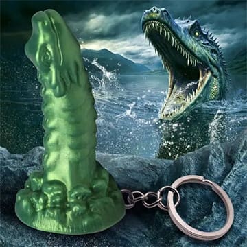 Green monster keychain with a silver ring.