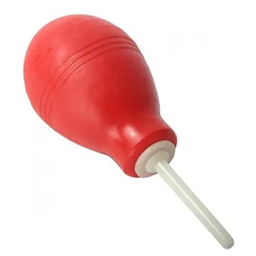 Red rubber bulb syringe with white nozzle.