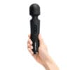 Black handheld massager with buttons and logo.