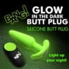 Green glow-in-the-dark silicone butt plug.
