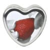 A heart-shaped tin with a strawberry inside.