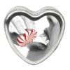 A heart-shaped tin with a candy.