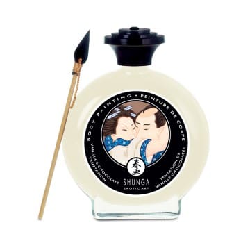A bottle of cream with a brush on top