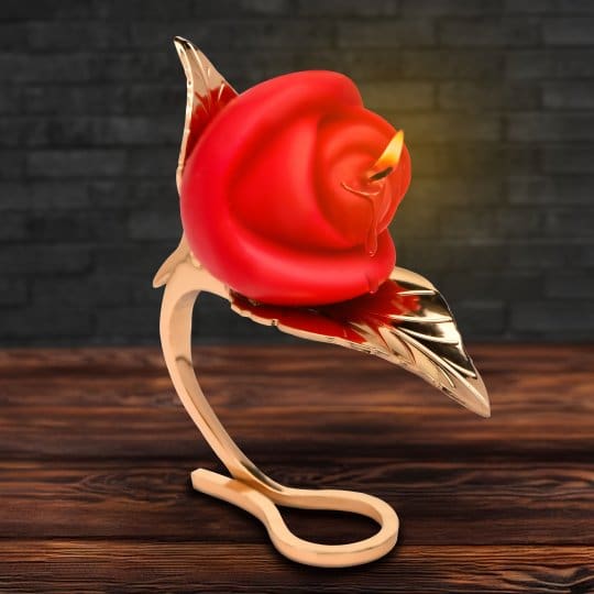 Gold rose candle holder on wood table.