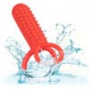 Red silicone ring toy in water.