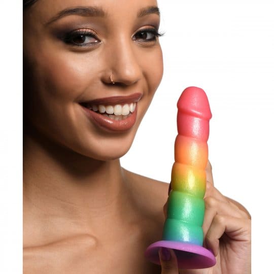 Woman holding rainbow-colored sex toy.