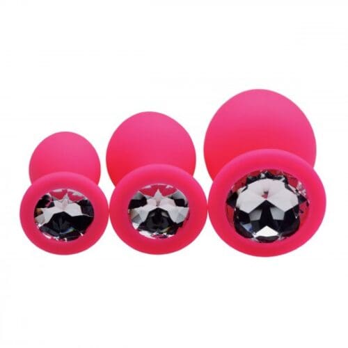 Pink jeweled butt plugs in various sizes.