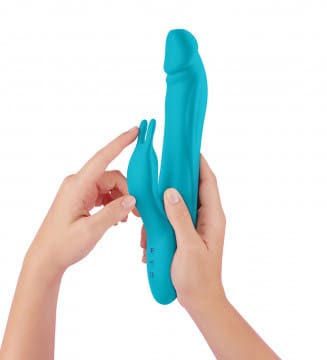 A person holding a blue toy in their hands.