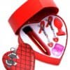 A heart shaped box with various items inside of it.
