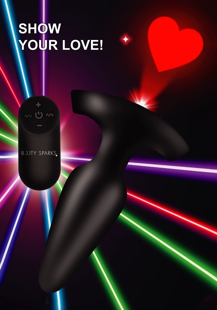 A black and red heart with a remote control
