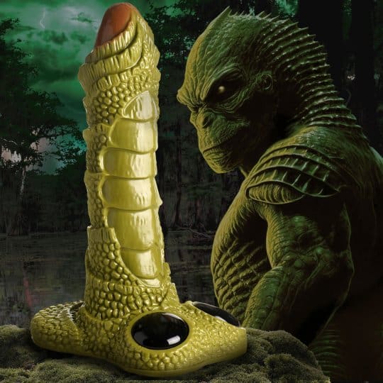 A large dildo is next to a creature.
