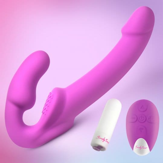 A purple sex toy is laying on the ground.
