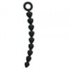 A black string of beads hanging from the end.