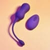 Purple wireless remote control vibrator on orange.